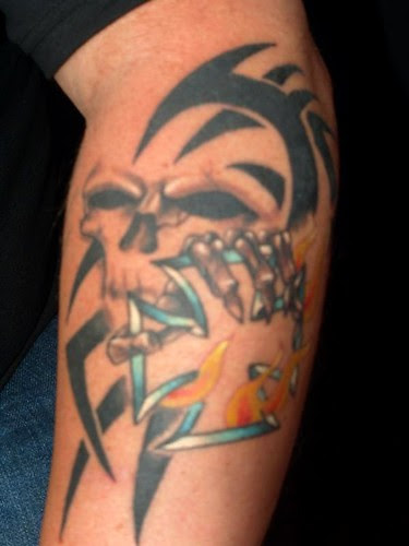  Skull flames bones arm tattoo ----Seen Tattoo Bronx NY studio 