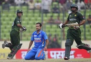 Mohammad Hafeez and Nasir Jamshed run past each other as Irfan Pathan looks on, India v Pakistan, Asia Cup, Mirpur, March 18, 2012