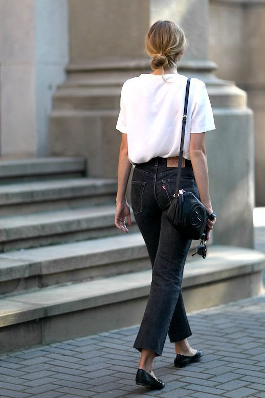 Le Fashion Blog Fall Blogger Style Blonde Low Bun Red Lips Slouchy White Tee Leather Gucci Crossbody Bag With Tassel Raw Hem Cropped Levis Black Jeans Flats Via Fashion Mugging