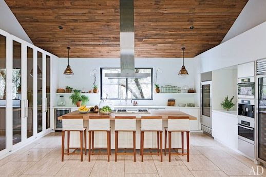LE FASHION BLOG JENNI KAYNE CONTEMPORARY BEVERLY HILLS HOME ARCHITECTURAL DIGEST CALIFORNIA FASHION DESIGNER MID CENTURY MODERN EXPOSED RUSTIC WOOD PANEL CEILING BRIGHT WHITE KITCHEN WOOD COUNTER TOP STAINLESS STEEL APPLIANCES WOOD LINEN STOOLS WIDE TILE FLOORS FLOORING GLASS PANEL CABINETS COPPER LIGHT FIXTURES 3 photo LEFASHIONBLOGJENNIKAYNECONTEMPORARYBEVERLYHILLSHOMEARCHITECTURALDIGEST3.jpg