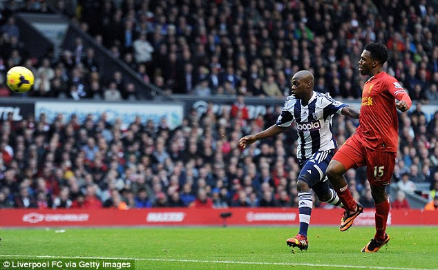 Lofted: Daniel Sturridge chips the ball into the net for Liverpool against West Brom