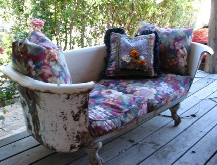 Bathtub sofa: repurposed old claw foot bath tub made into a porch seating area #repurposed #gardenart #gardenfurniture