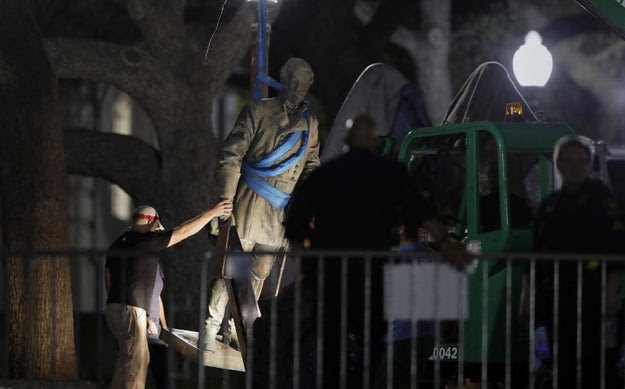 The University of Texas at Austin abruptly took down four Confederate statues — including one of Gen. Robert E. Lee — on a prominent part of the campus early Monday morning.