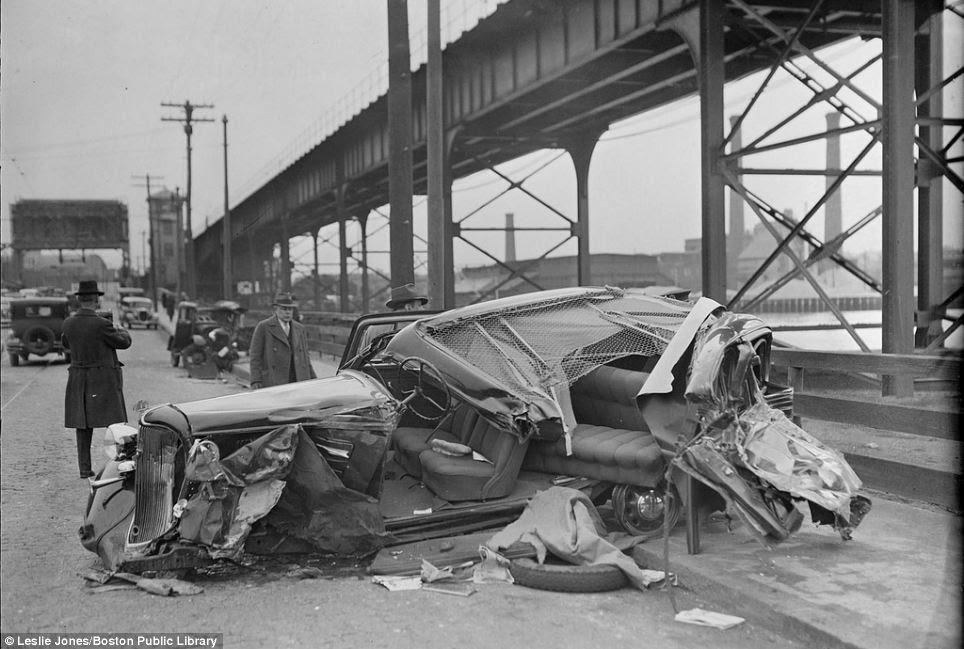 The scene of an accident in 1935. Information with the photo reveals a car stolen by joyriding children crashed into a lawyer's car, killing him 