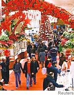 [Shoppers visit the Manhattan Macy's store on Christmas Eve.]
