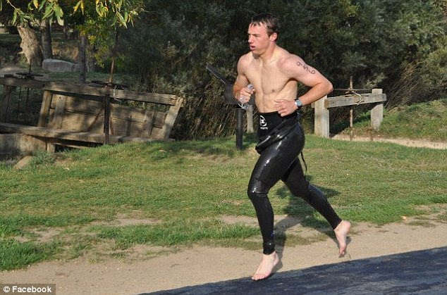 Massacre on the mind? Federal court records say Kusick, pictured during a recent triathlon, revealed he took a shotgun from his aunt's house and tried to buy ammunition for it