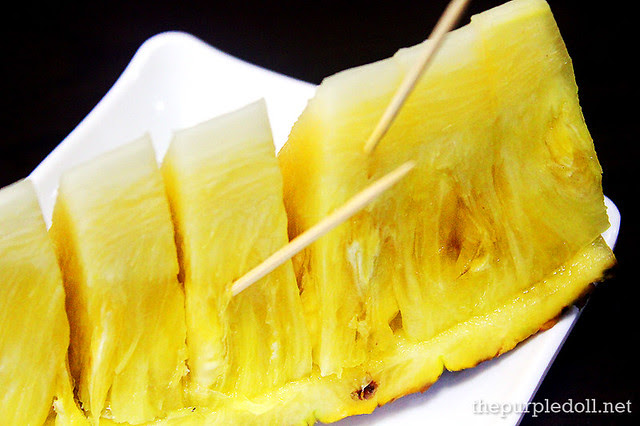 Complimentary pineapple slice for dessert