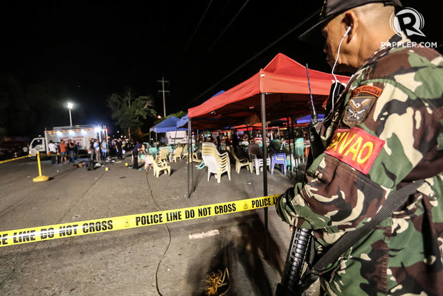 HEIGHTENED ALERT. A member of Task Force Davao secures the blast site.  