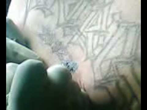 ambigram tattoo of my last name "martinez" done on my back 7.5hrs worth of 