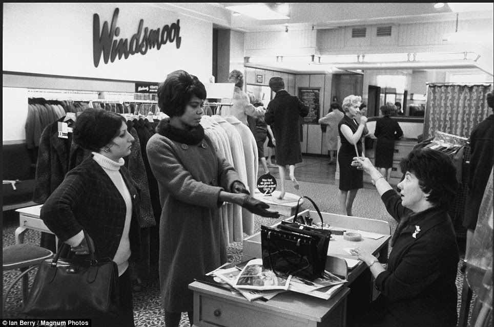 Some things in London change very little - as shown by these glamorous women shopping in Oxford Street on the hunt for the latest styles