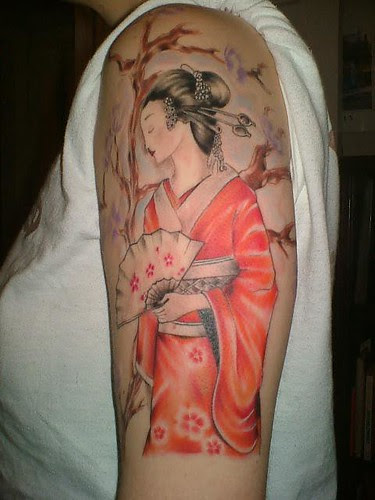 Tattoo is Japan girl at woman arm   