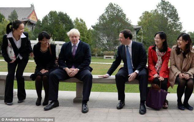 Safe seat: Posing for pictures, Mr Osborne had to persuade Mr Johnson to sit closer to him 