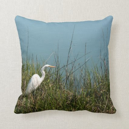 White egret standing in grass w water throw pillows
