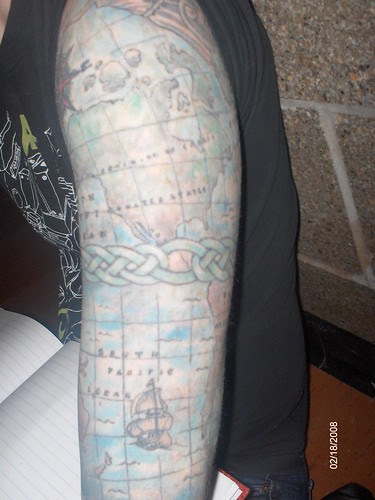 Old map tattoo on arm