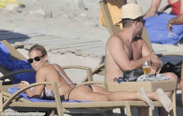 Soaking up the sun: Bar's high-cut bikini briefs drew attention to her enviably pert posterior