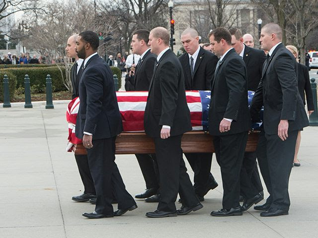 The casket of U.S. Supreme Court Justice Antonin Scalia arrives at the Supreme Court in Washington, DC, on February 19, 2016, where it will lie in repose until his funeral at the Basilica of the National Shrine of the Immaculate Conception on February 20. (Nicholas Kamm/AFP/Getty Images)
