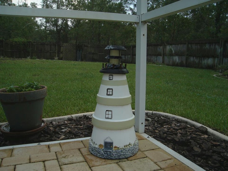 Lighthouse made of planters | boat and seaside landscaping | Pinterest