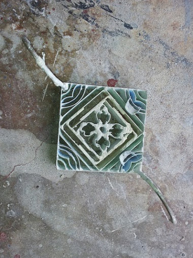 A cement tile mold acts as a blank canvas