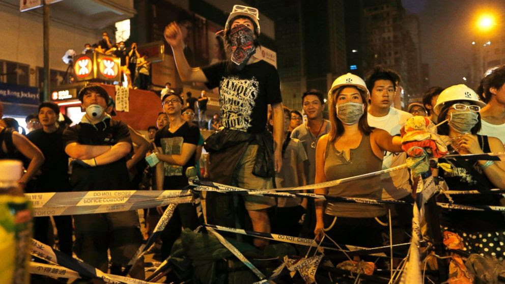 PHOTO: Pro-democracy protesters stage a rally on a occupied road in Mong Kok district, Hong Kong, Sunday, Oct. 5, 2014.