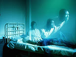 Man getting up from hospital bed  (Adri Berger/Getty Images)