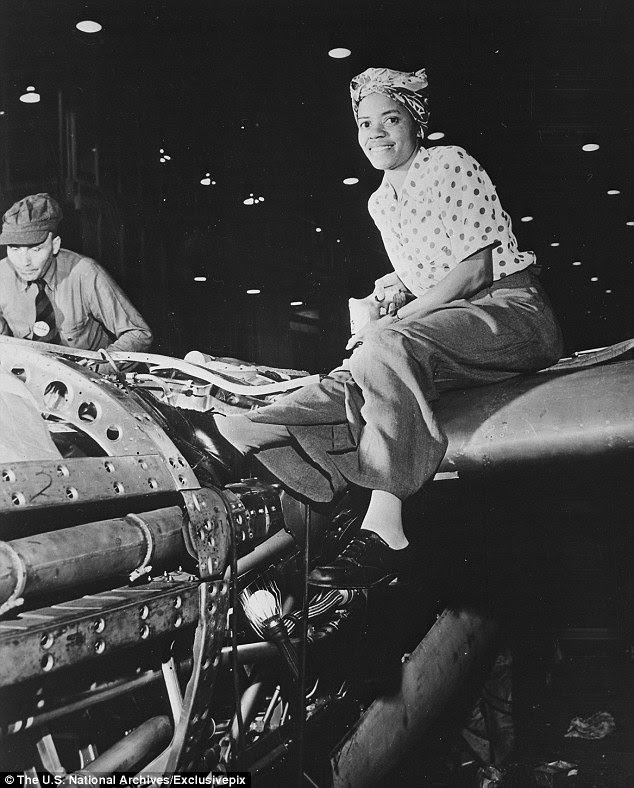 War effort: A female riveter sits atop an aircraft at U.S. aircraft manufacturing firm Lockheed Corporation during the Second World War