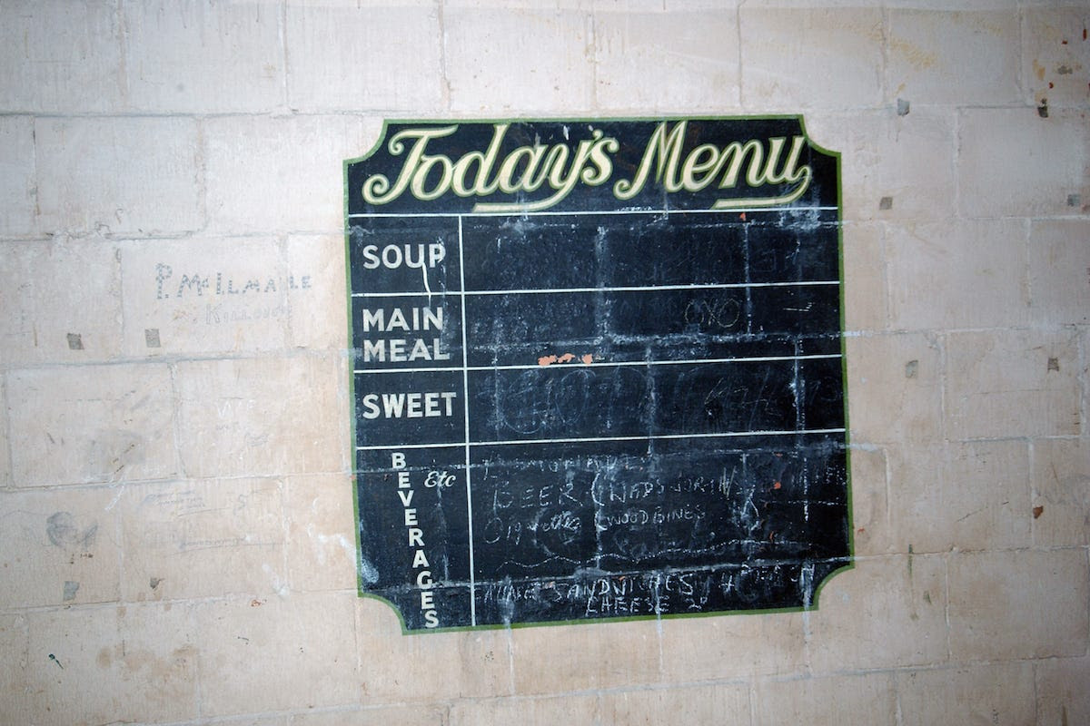 The site had two canteens. This is a chalk menu board outside one of them.