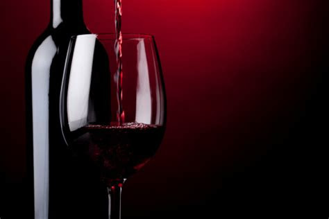 Red wine fans happily drank up the news that their favorite libation was actually beneficial. Pouring Red Wine Stock Photo - Download Image Now - iStock