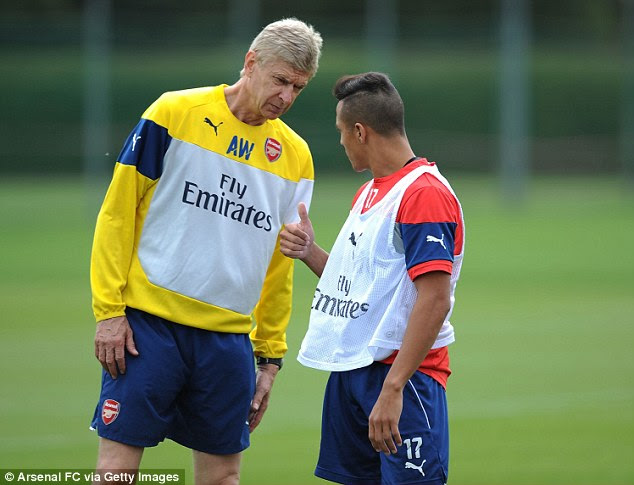 Good to go: Sanchez was signed by Arsenal boss Arsene Wenger (left) for £30million in July