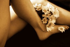 Still life with human legs and daisies