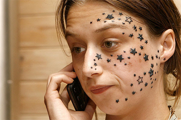 extra: Sparkles and a star tattoo like this on the left side of the stomach