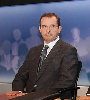 Journalist Pavlos Tsimas at the six party lead...
