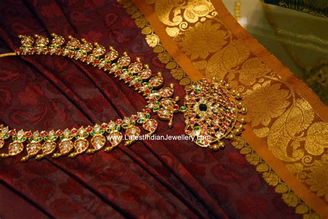 Giriraj jewellers presents an evergreen stud earring pair in ruby stone. Heavy Ruby Mamidi Pindela Haram - Latest Indian Jewellery