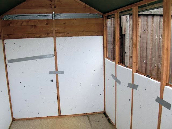 Polystrene insulation fitted between the uprights of the shed.