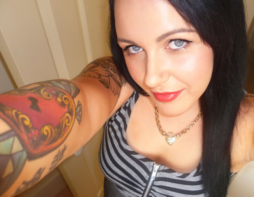 Piercings Not Shown:7 x each ear, belly button x 2, helix, tragus x 2