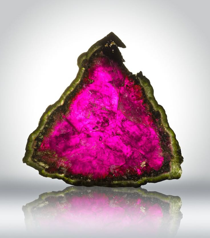Watermelon tourmaline. Tourmaline is a crystal boron silicate mineral compounded with elements such as aluminium, iron, magnesium, sodium, lithium, or potassium. Tourmaline is classified as a semi-precious stone and the gemstone comes in a wide variety of colors. The name comes from the Sinhalese word "Thuramali" or "Thoramalli", derived from different gemstones found in Sri Lanka. [Wikipedia]