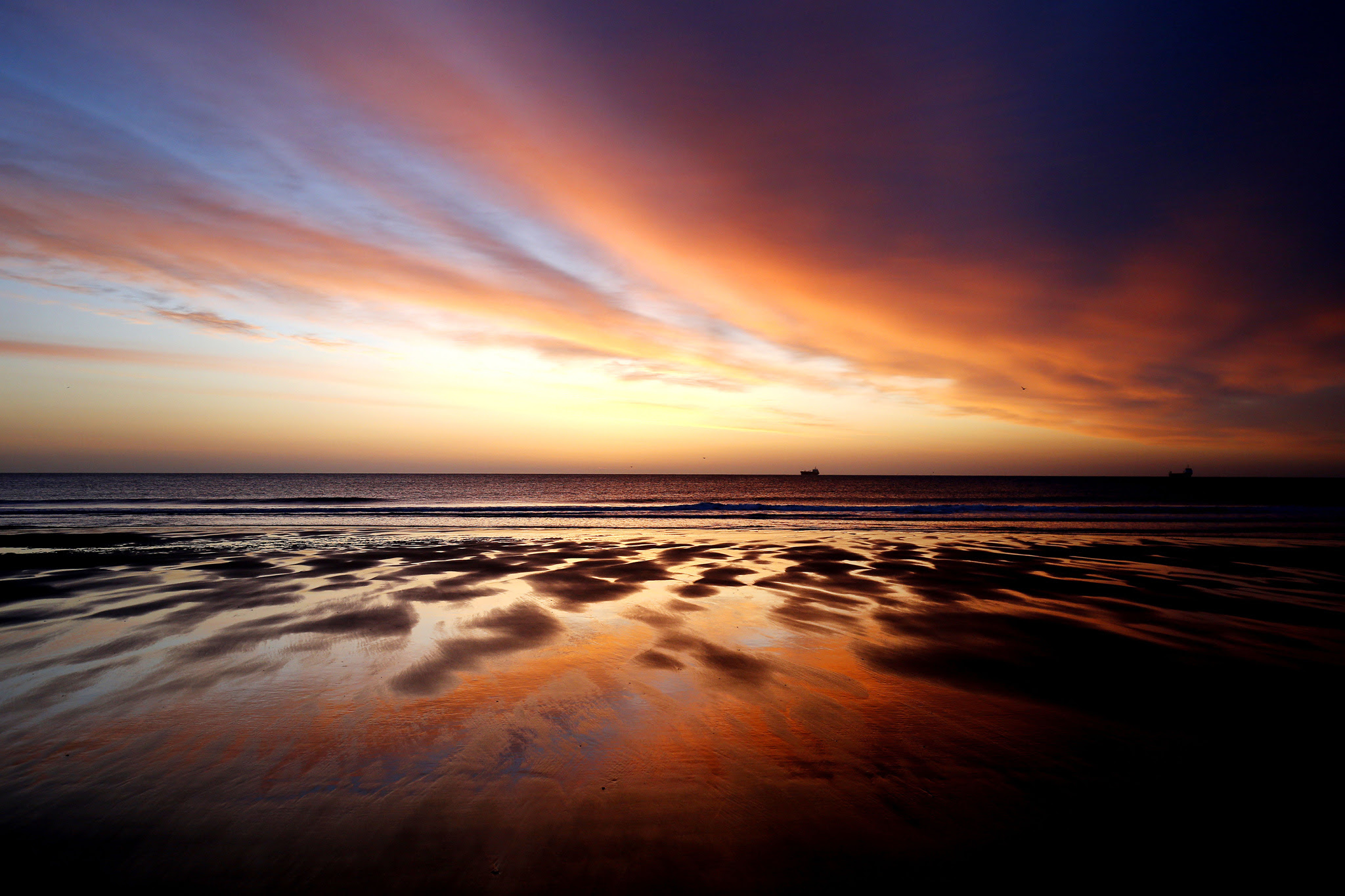 Spring weather Apr 19th 2016...A ship sits out in the North Sea near Tynemouth beach, North Tyneside, just before sunrise. PRESS ASSOCIATION Photo. Picture date: Tuesday April 19, 2016. Photo credit should read: Owen Humphreys/PA Wire