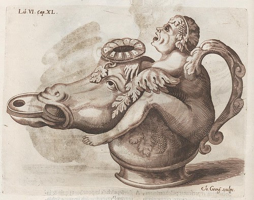 cow-head vessel with head of distressed man - as jug handle - straddling cow head
