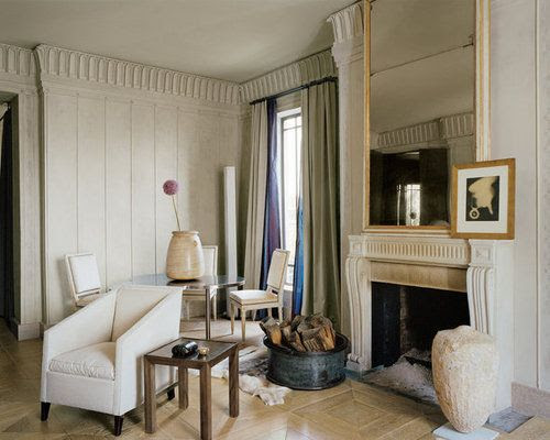 Stephen Sills’s New York apartment ~ Italian Directoire mirror, a Man Ray photograph and a Greek marble urn complement the Louis XVI fireplace. François Halard via T Magazine.