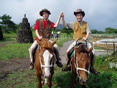 Dooshik and Greg riding a horse