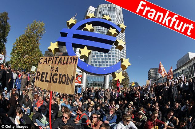 Angry: Thousands of protesters are taking to the streets of Frankfurt, Germany
