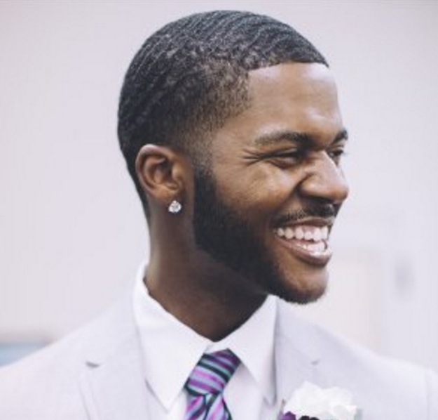 In his poem, titled "Lift Off," Livingston — who earned his M.Ed in learning and teaching — spoke about the struggles and obstacles that black people have faced in getting an education.