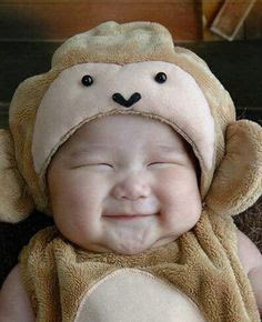 smiling pooping baby in a cute monkey costume | Tacky Harper's Cryptic Clues