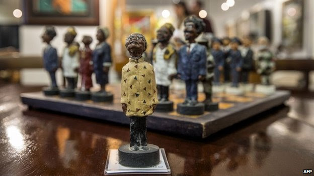 A chessboard, showing South Africa's politicians, including late President Nelson Mandela (C) as the the king figurine