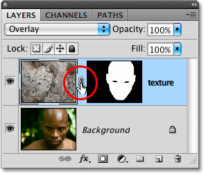 Unlinking the layer contents from the layer mask in Photoshop. Image © 2009 Photoshop Essentials.com.