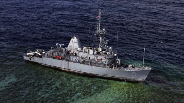 WAITING TO BE DISMANTLED. The mine countermeasures ship USS Guardian (MCM 5) sits aground Tuesday, January 22, 2013 on the Tubbataha Reef in the Sulu Sea. AFP PHOTO / US NAVY