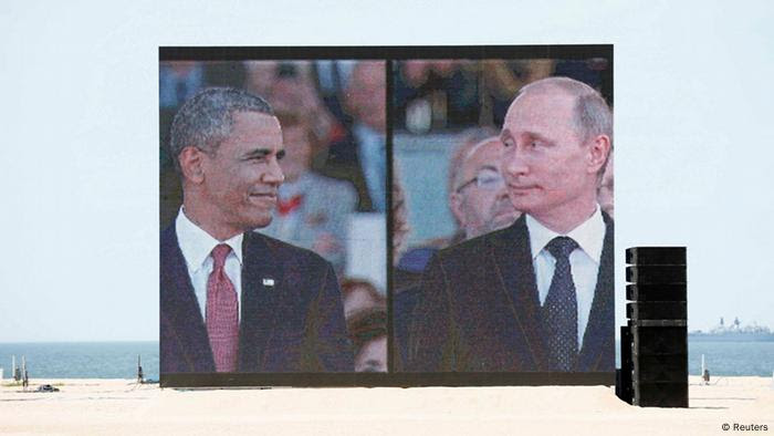 Video-Leinwand mit Putin und Obama (Foto: Reuters)