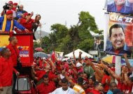 Venezuela's President Hugo Chavez greets supporters during an election rally in Barcelona