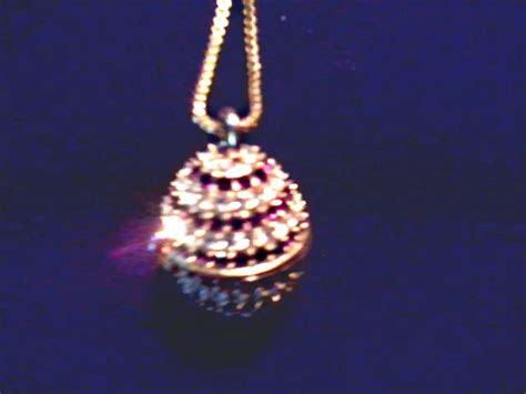 This is a new in box fondini collection watch and sun glasses set. "Xanadu" Rhinestone Egg Pendant Watch /Quartz Movement