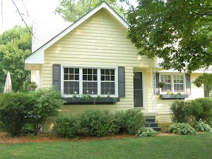 Light Yellow House With Black Shutters