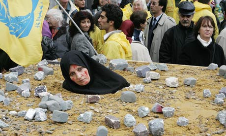 An Iranian woman at a protest in Brussels highlights the barbarity of death by stoning